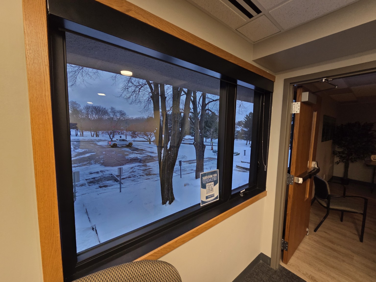 Close‑up of a newly installed window with wood trim at Eden Prairie Senior Center